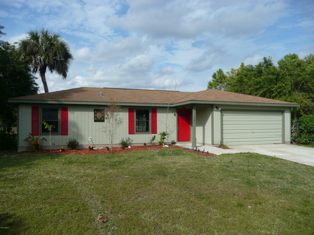 Property Photo:  877 NW Serenade Street  FL 32907 