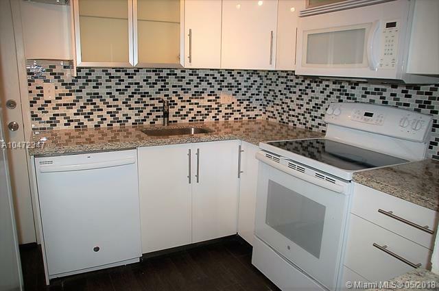 Property Photo:  1050 SE 15th St 203  FL 33316 