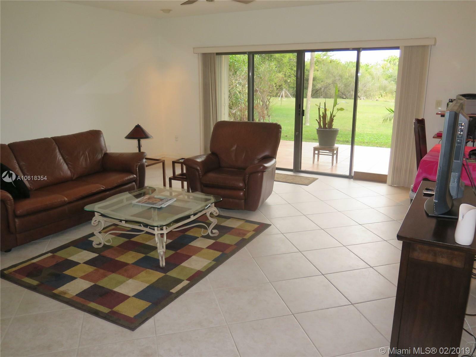 Property Photo:  9033 SW 62nd Ter 4-D  FL 33173 