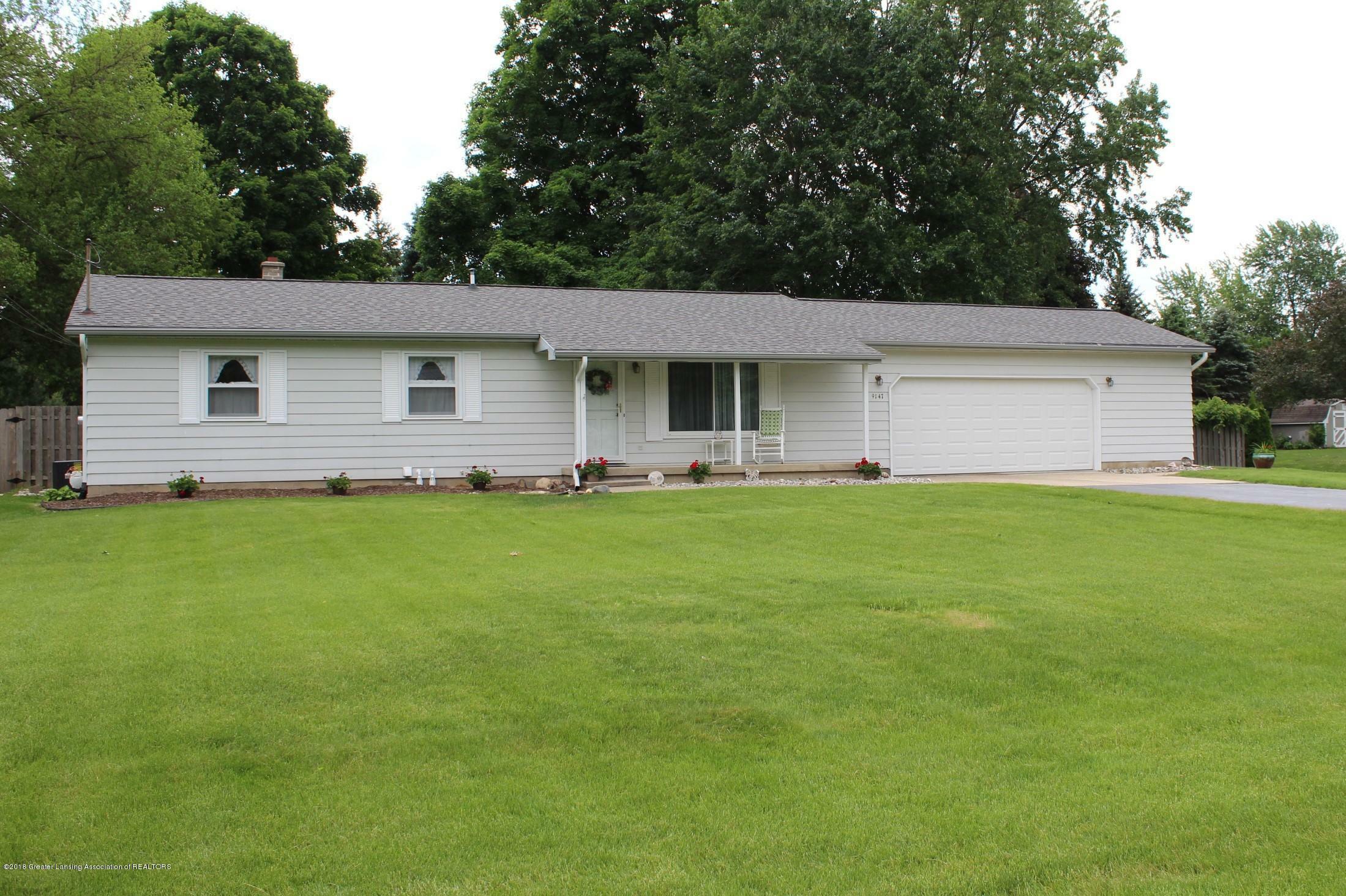 Property Photo:  9147 Riverside Drive  MI 48837 