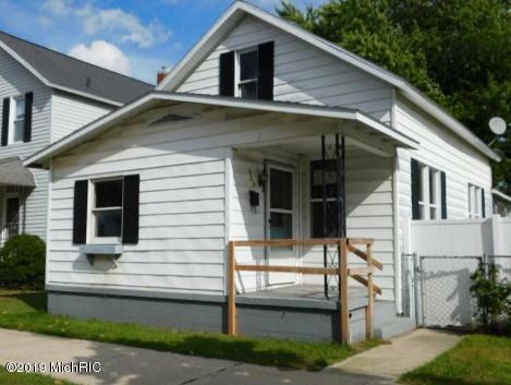 Property Photo:  303 S Washington Avenue  MI 49431 