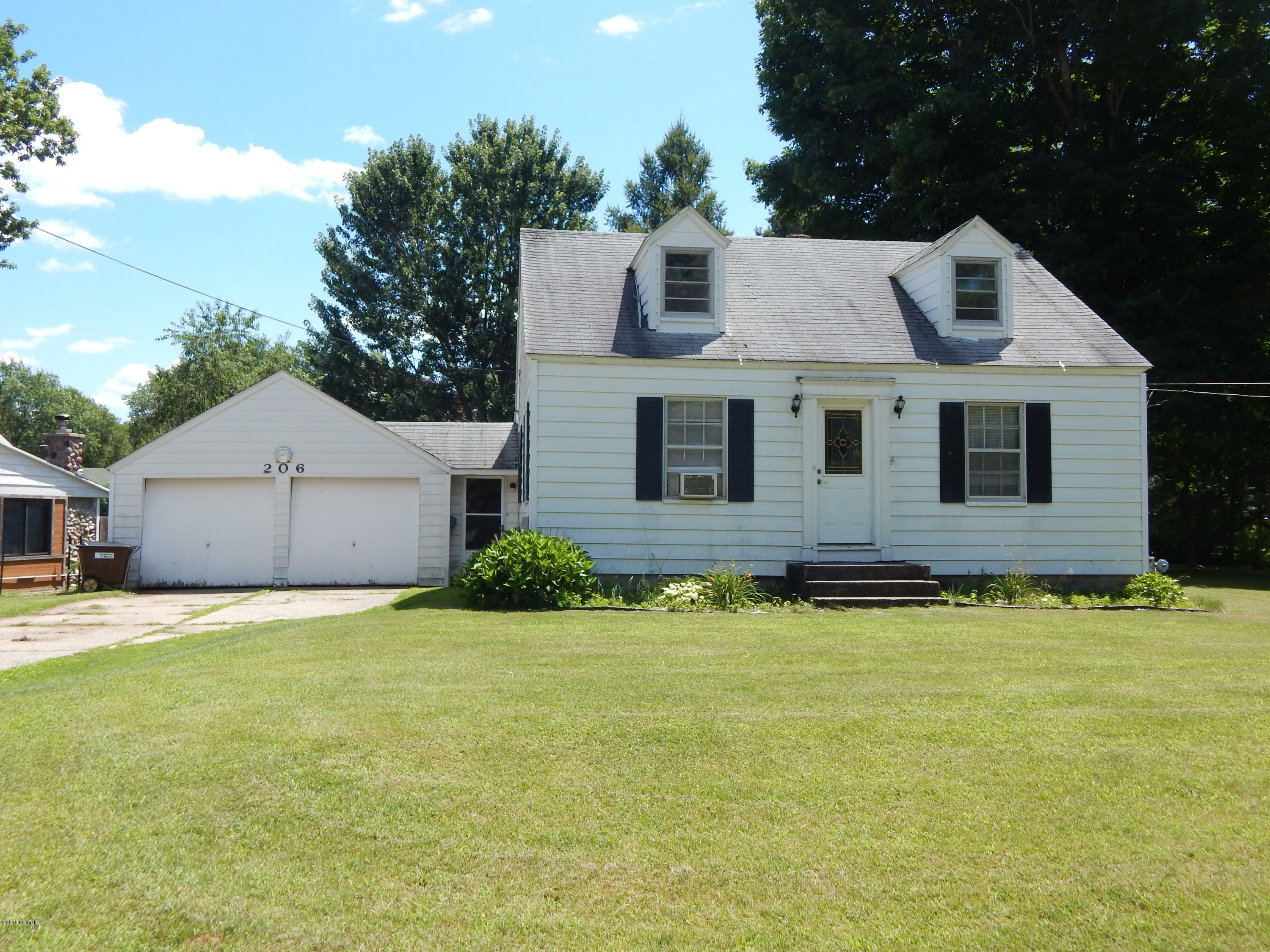 Property Photo:  206 Harper Drive  MI 49345 