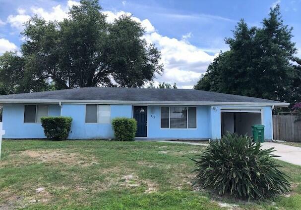 Property Photo:  412 SE Starflower Avenue  FL 34983 