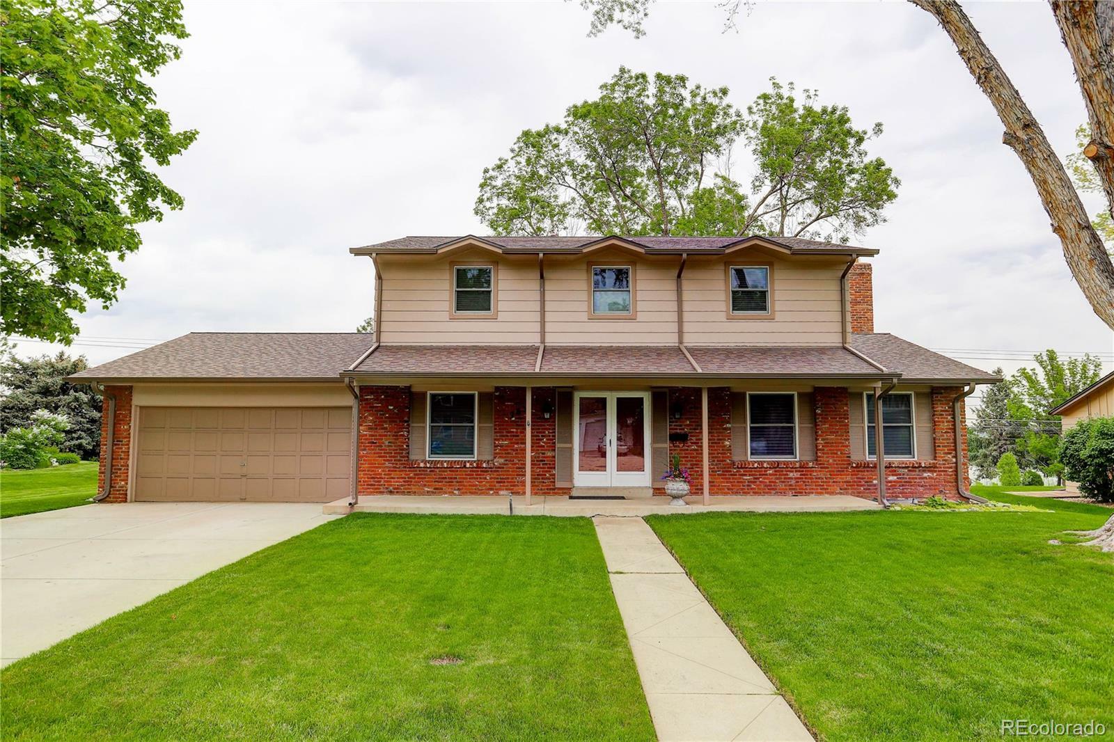 Property Photo: 4631 W Oxford Avenue CO 80236
