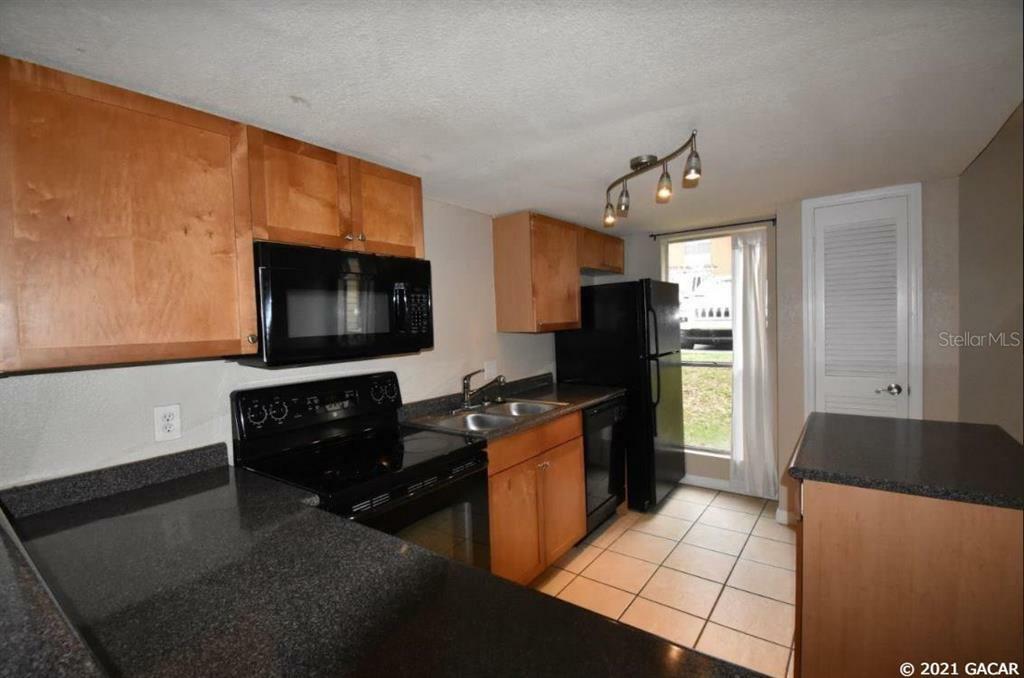 Property Photo:  1810 NW 23rd Boulevard 214  FL 32605 