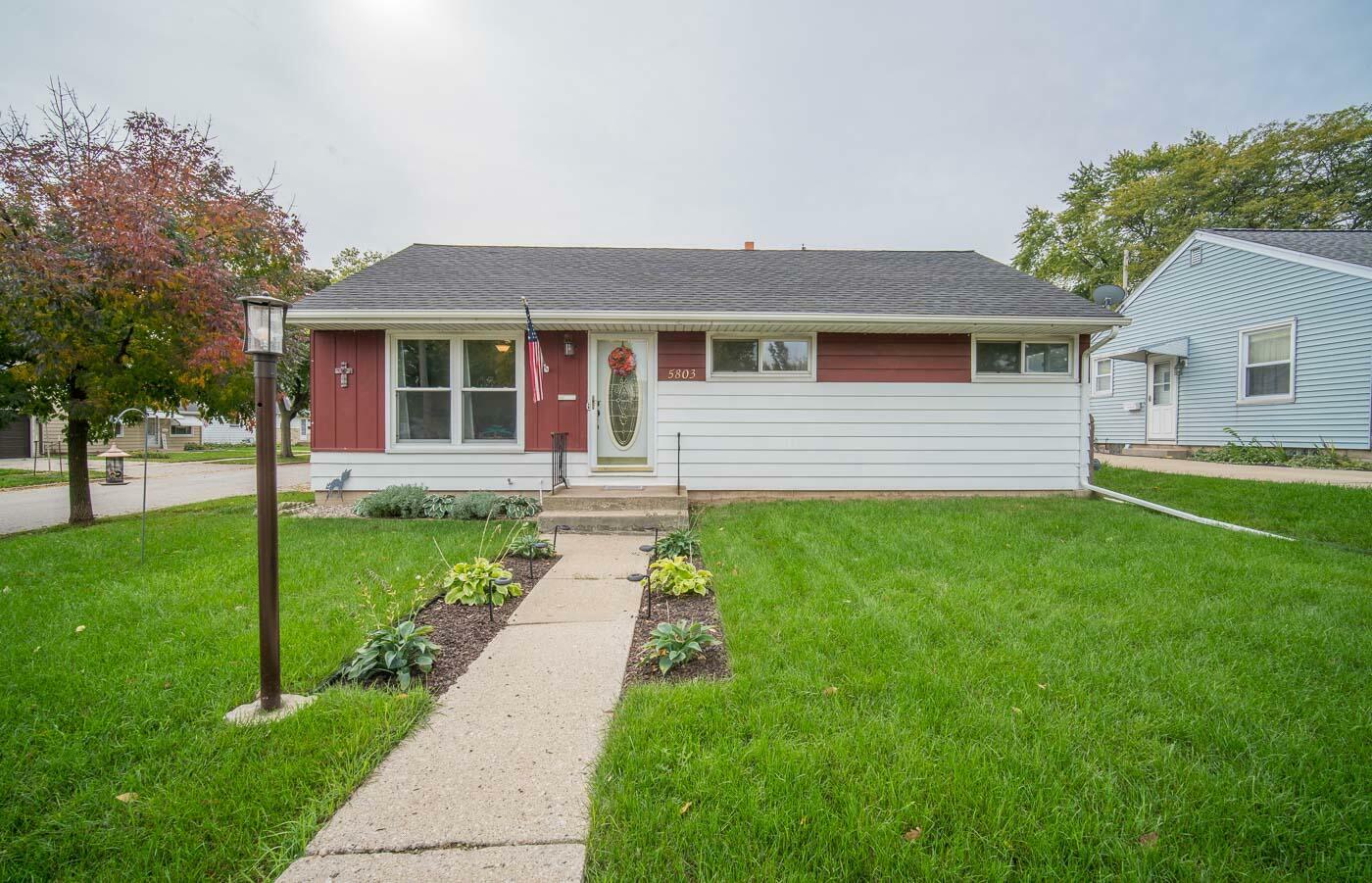 Property Photo:  5803 W Holt Ave  WI 53219 