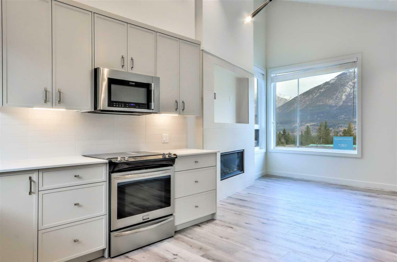 Property Photo:  209 Stewart Creek Rise 203M  AB T1W 0N9 