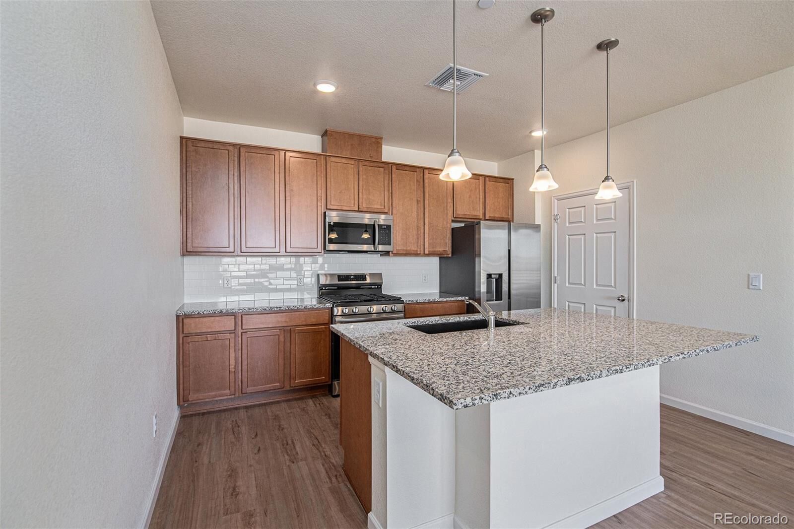 Property Photo:  6153 N Ceylon Street 202  CO 80249 