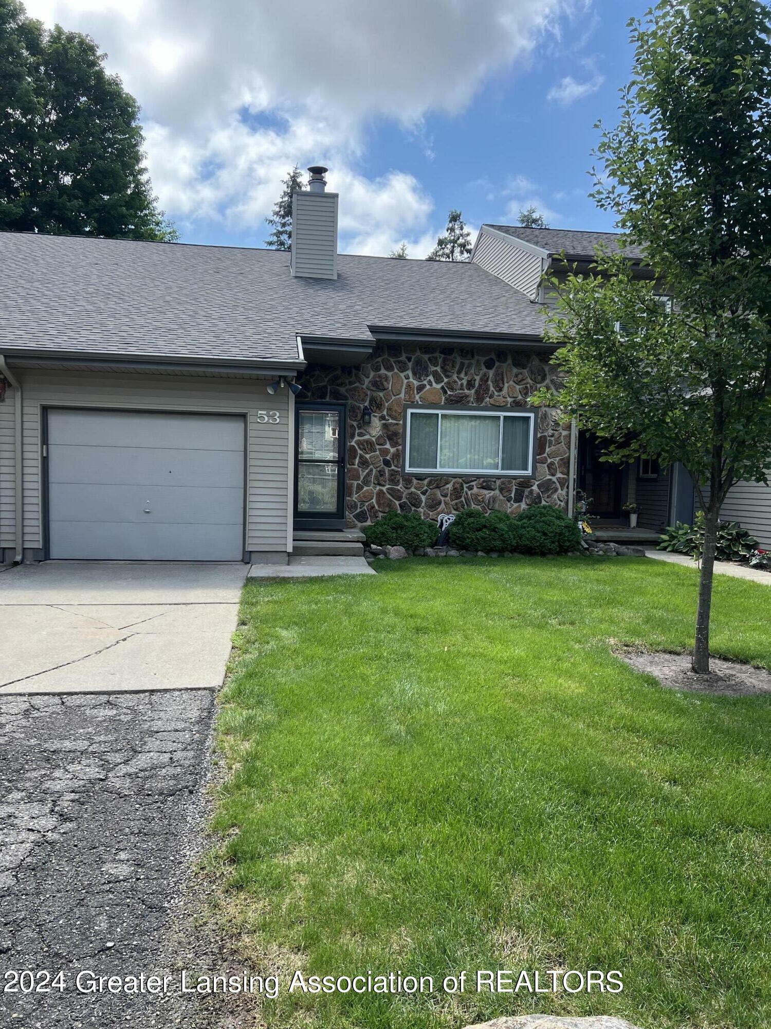 Property Photo:  1108 Timber Drive  MI 48837 