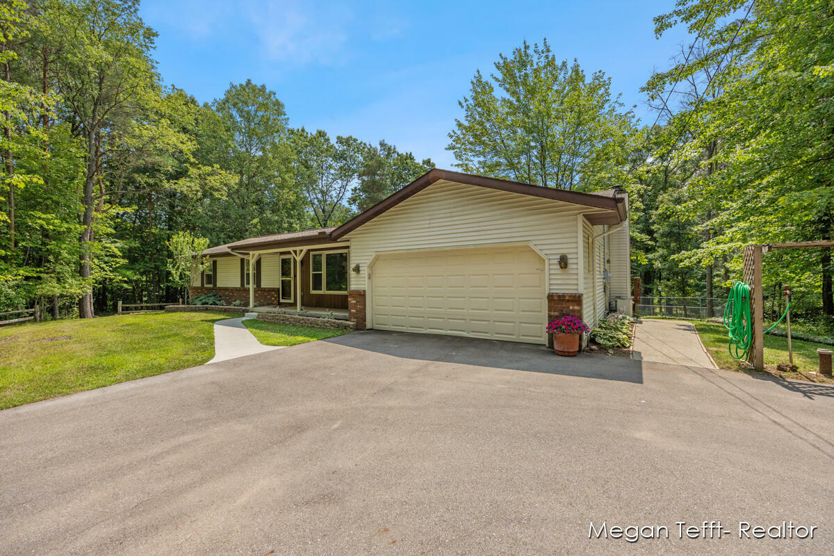 Property Photo:  6055 Pickerel Drive NE  MI 49341 