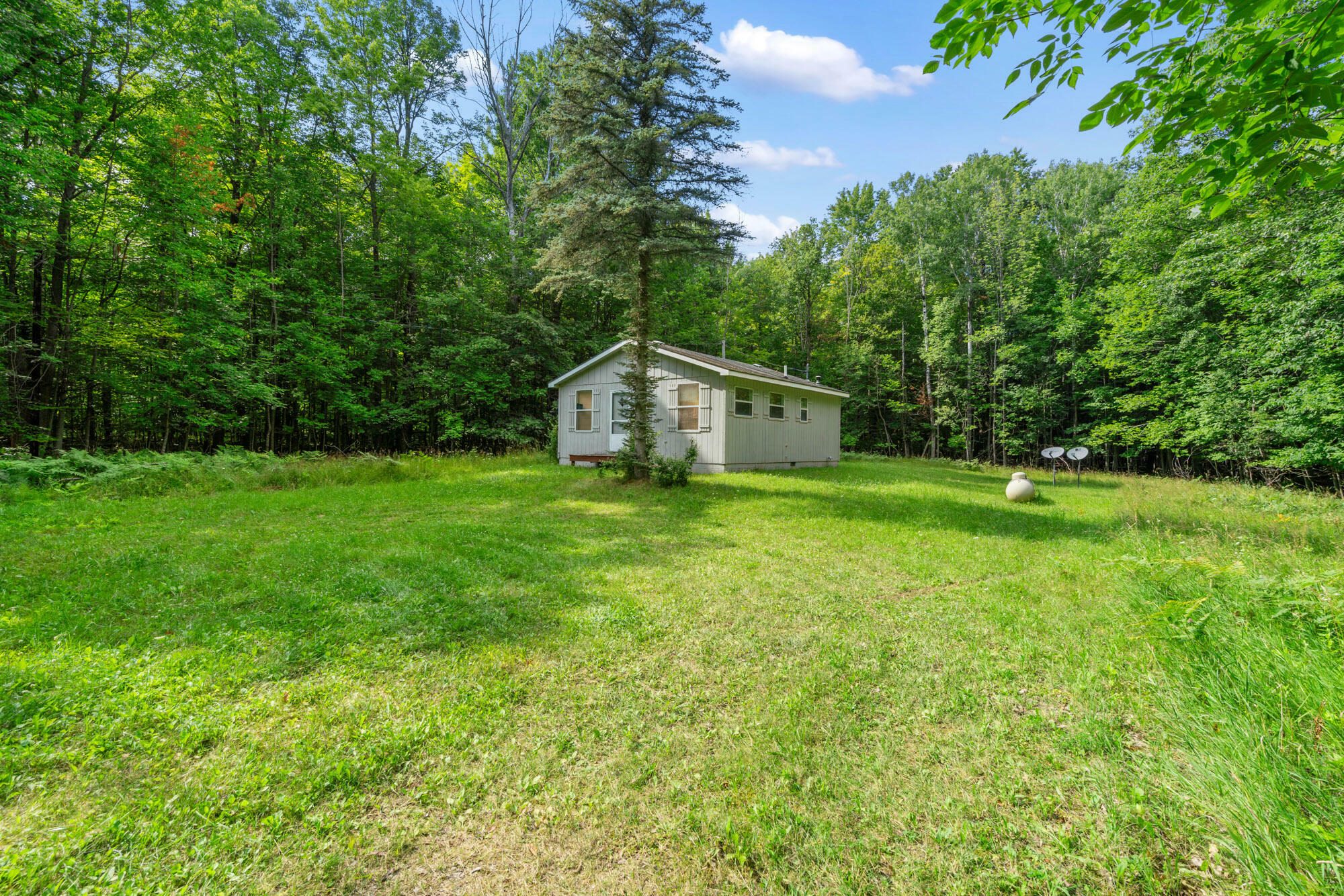 Property Photo:  4280 Woodmansee Road  MI 49721 