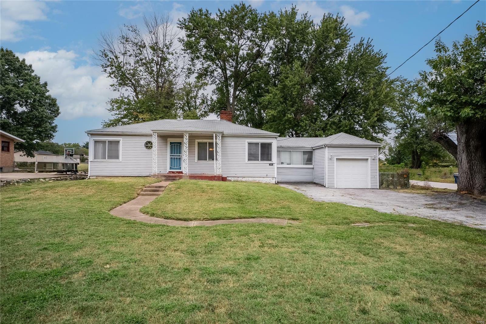 Property Photo:  1403 Trampe Avenue  MO 63138 