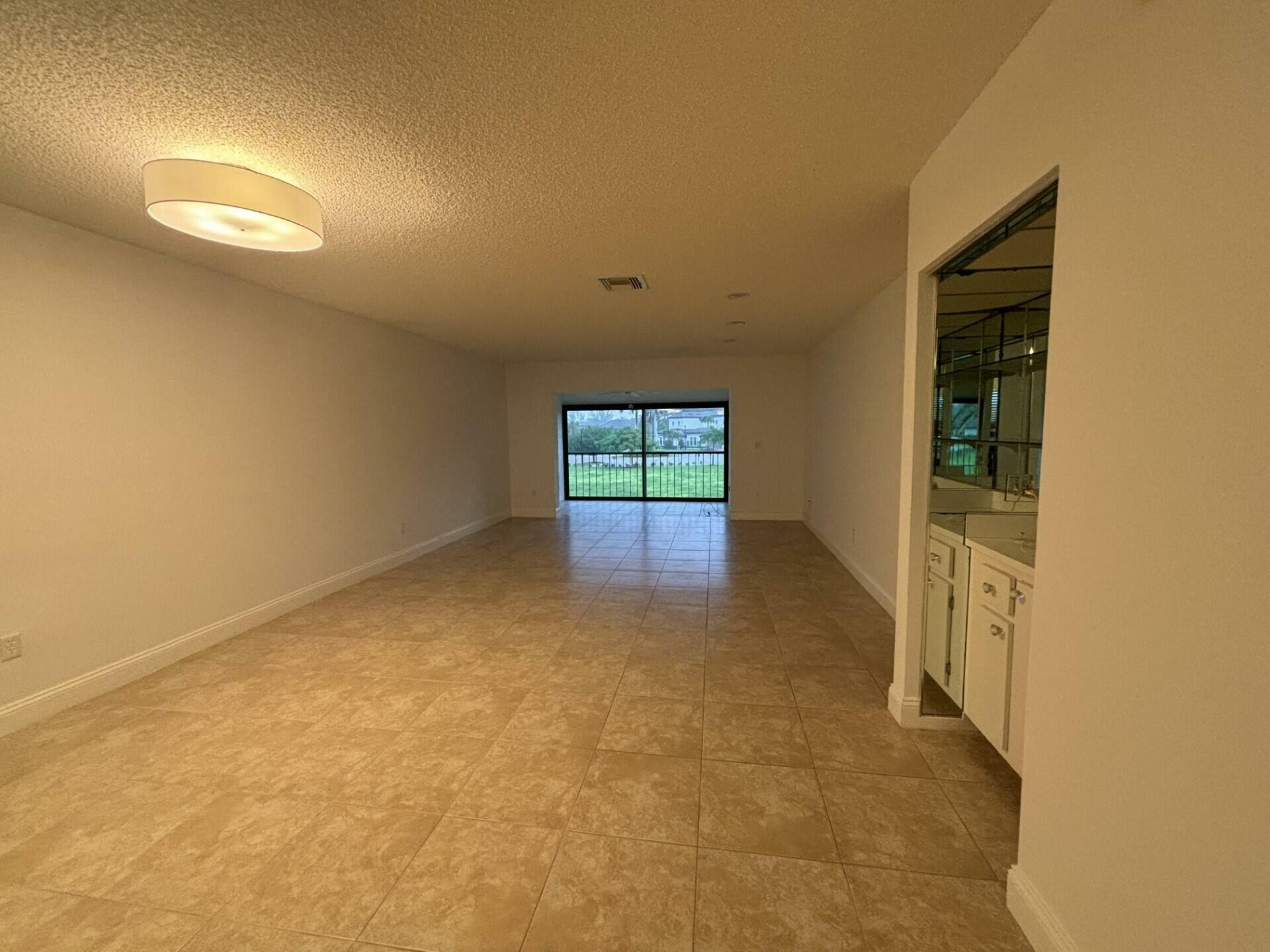 Property Photo:  9264 Vista Del Lago H  FL 33428 