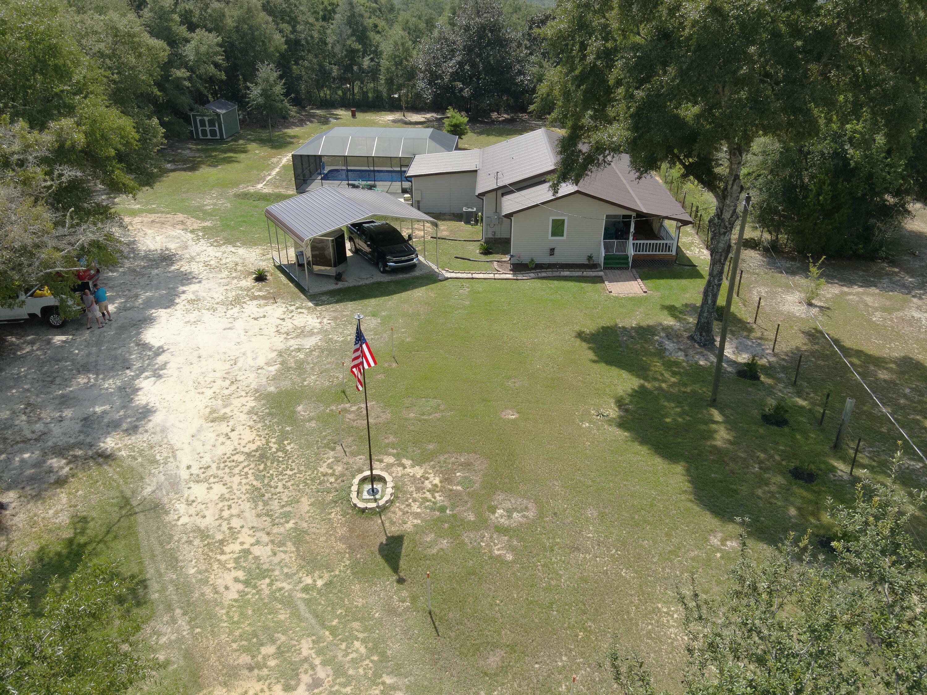 Property Photo:  5655 Jv Woolley Road  FL 32539 