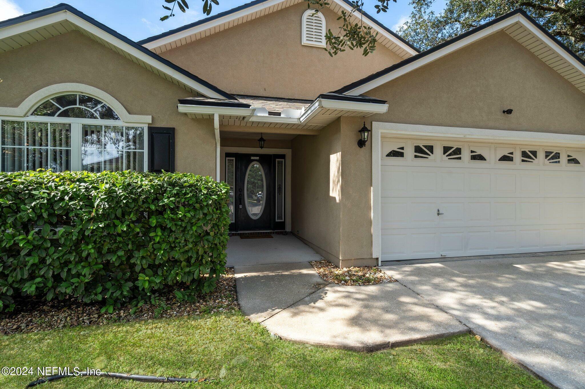 Property Photo:  1679 Canopy Oaks Drive  FL 32065 