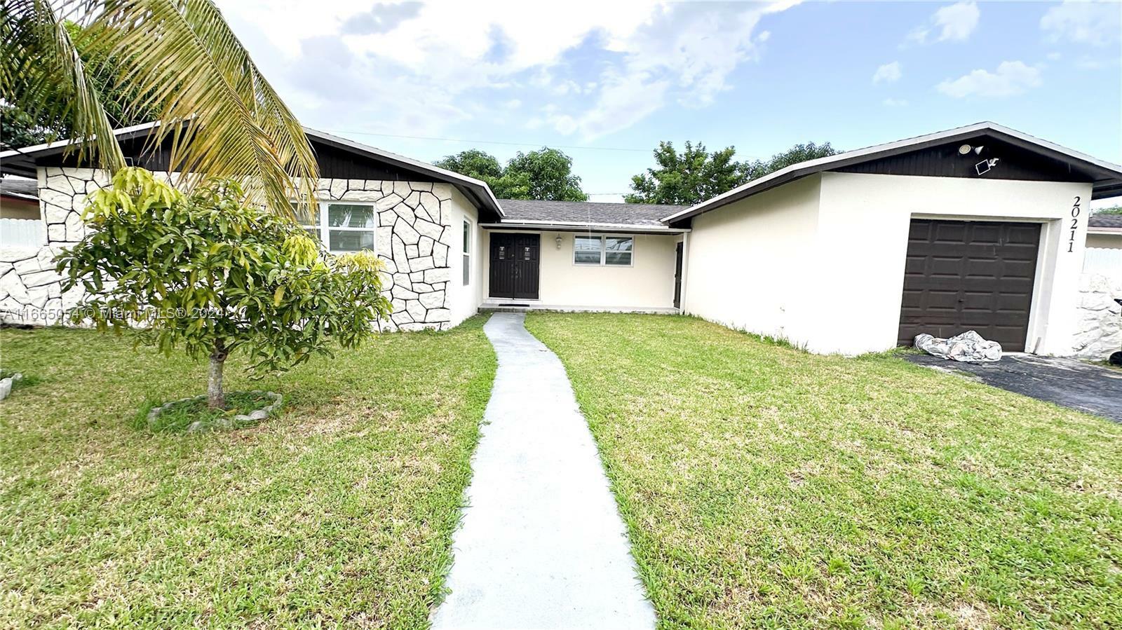 Property Photo:  20211 SW 116th Ave  FL 33189 