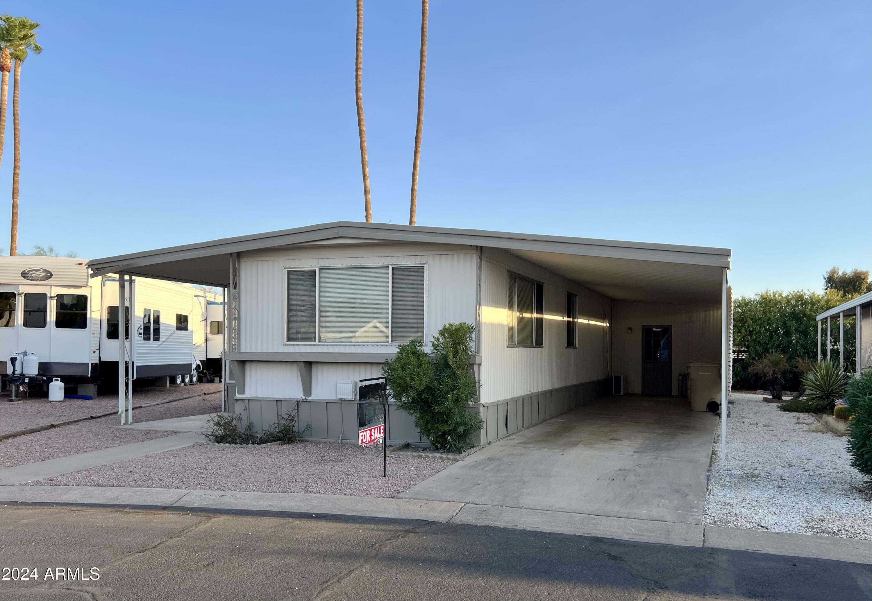 Property Photo:  11411 N 91st Avenue 217  AZ 85345 