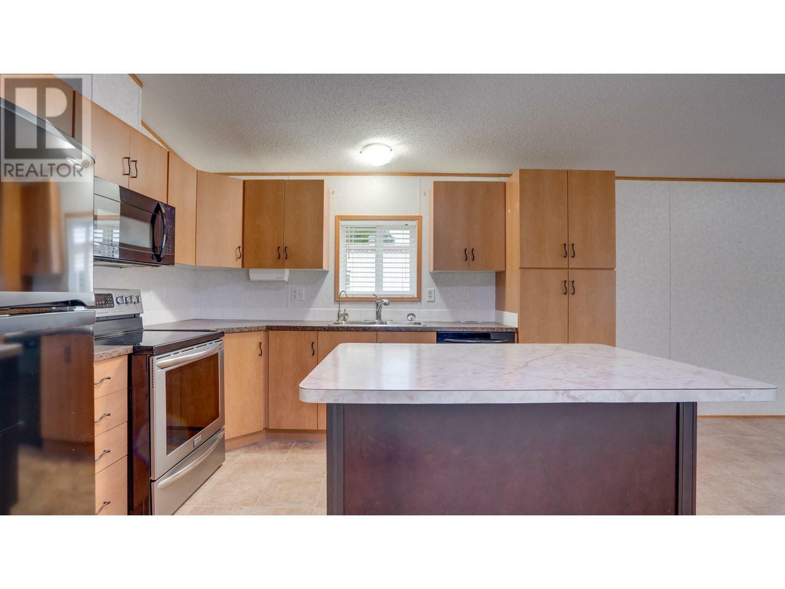 Property Photo:  6902 Okanagan Landing Road 34  BC V1H 1X4 