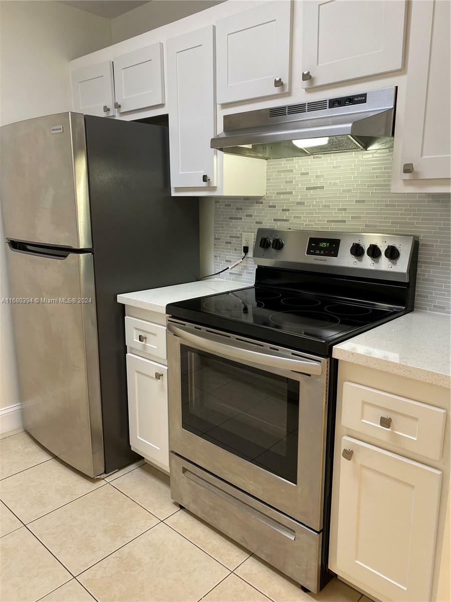 Property Photo:  801 SW 133rd Ter 203K  FL 33027 