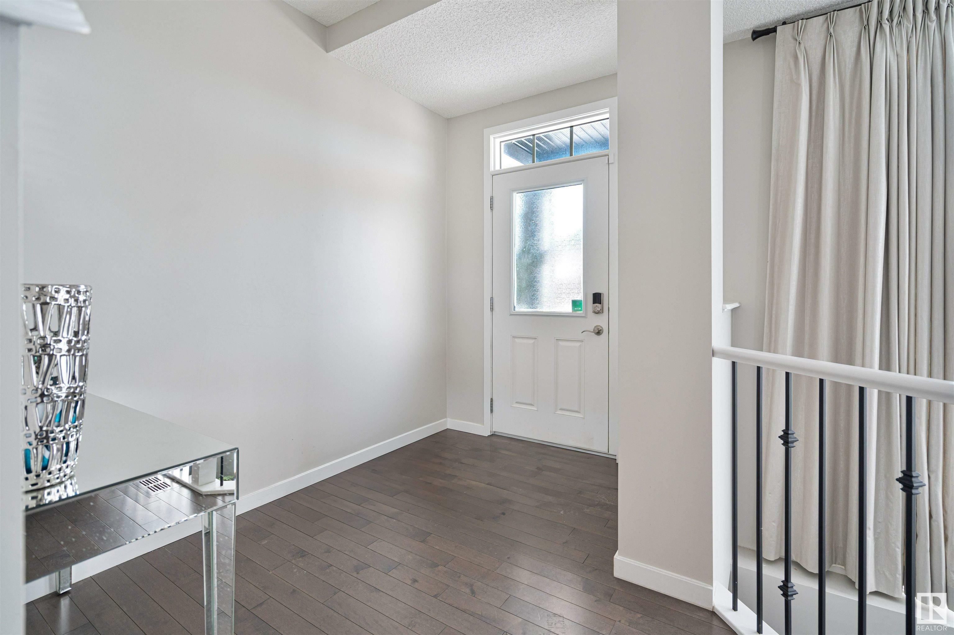 Property Photo:  703 Secord Boulevard NW  AB T5T 6Z6 