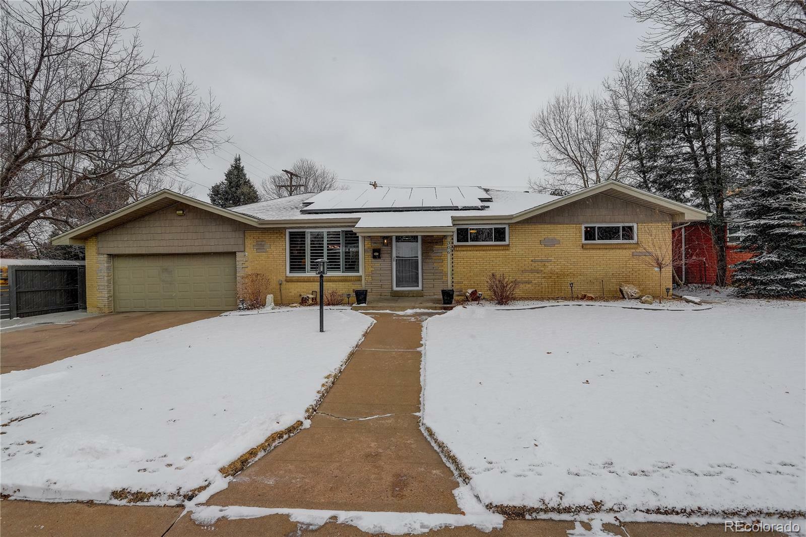 Property Photo:  306 S Newport Way  CO 80224 