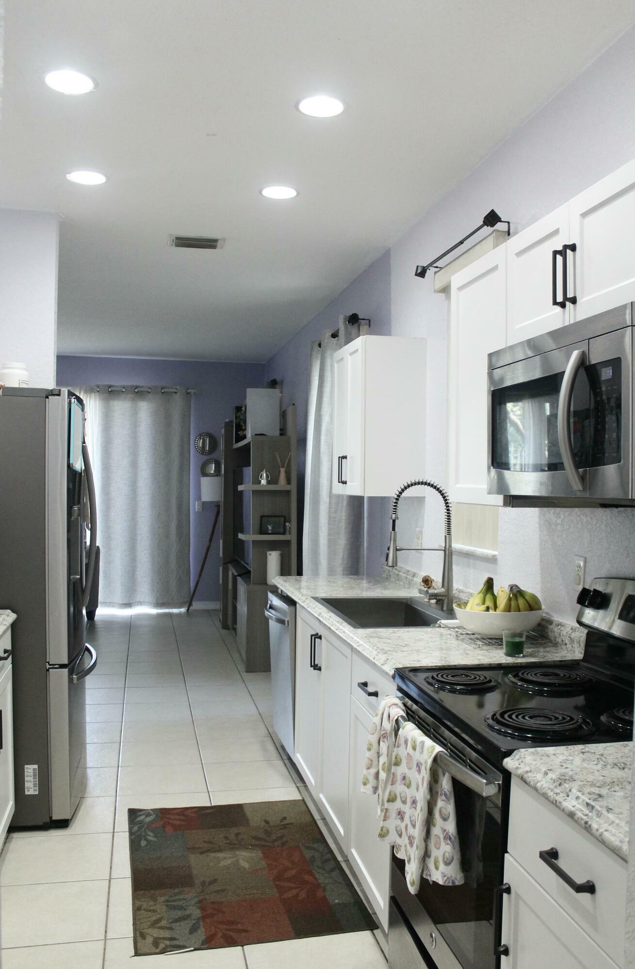 Property Photo: 5210 White Oleander FL 33415