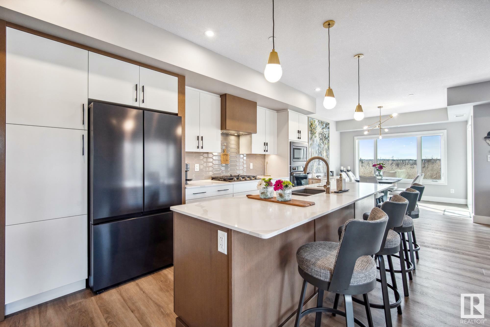 Property Photo: 7463 May Common NW 418 AB T6R 0X1