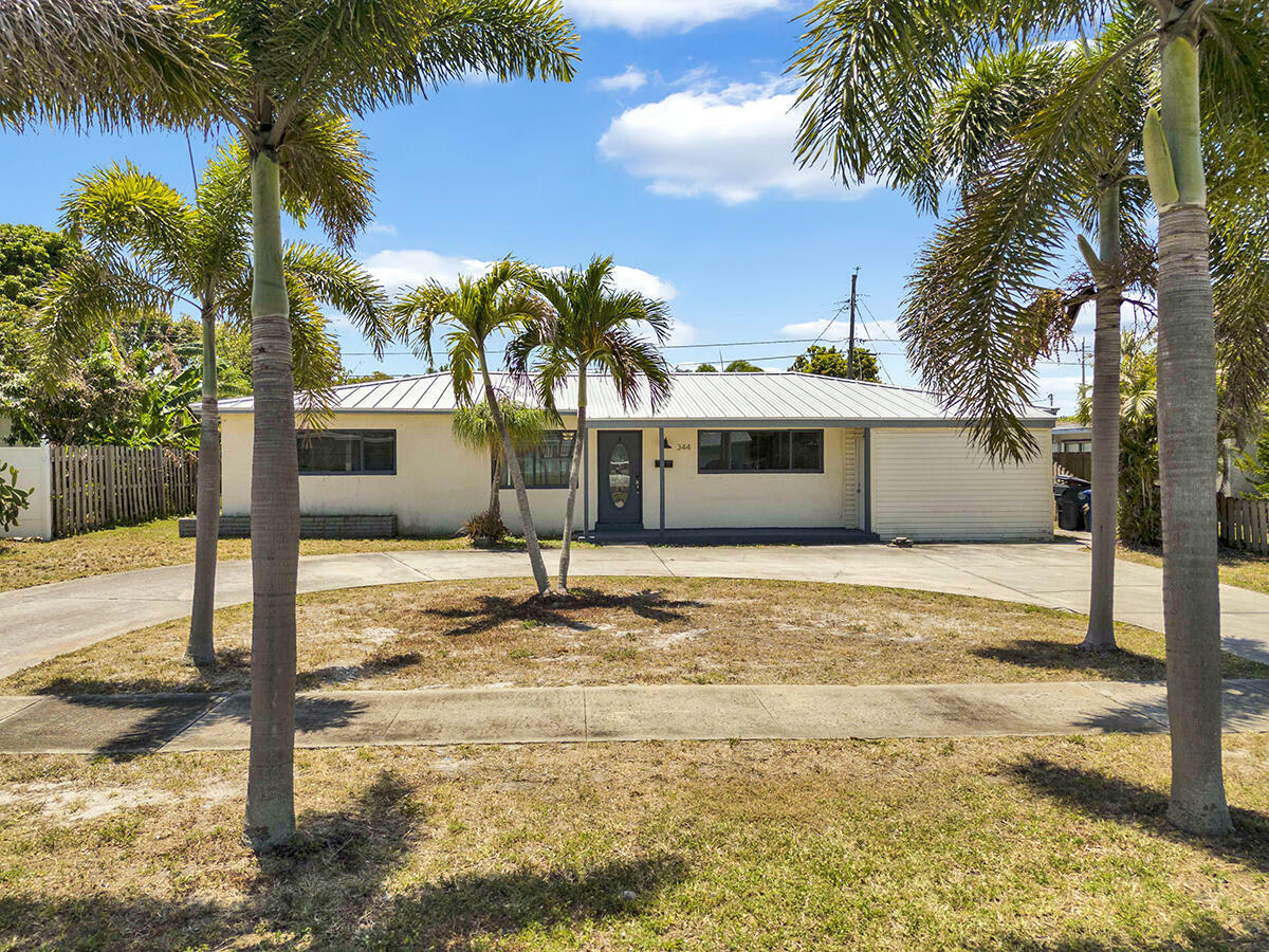 Property Photo: 344 E Jasmine Drive FL 33403