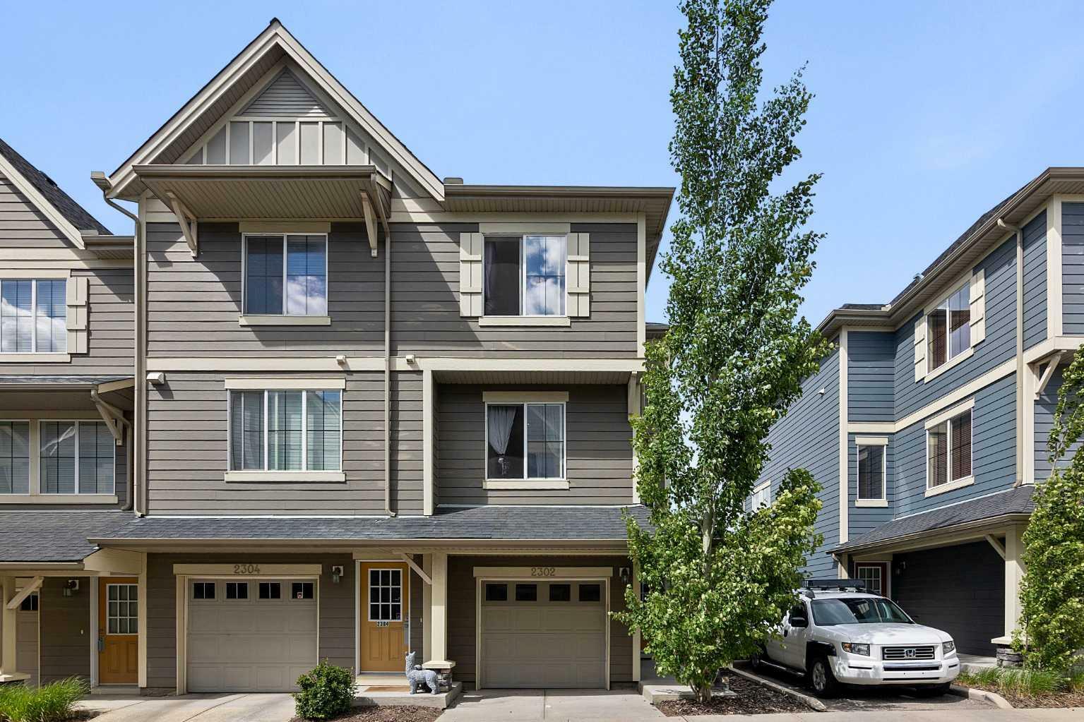 Property Photo: 125 Panatella Way NW 2302 AB T3K 0R9