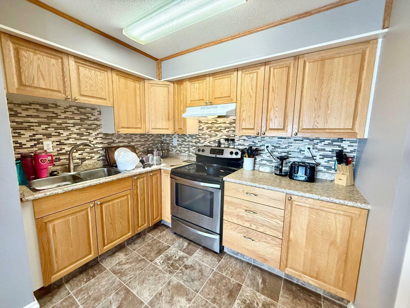 Property Photo: 110 Tamarack Avenue 32 AB T7V 1C5
