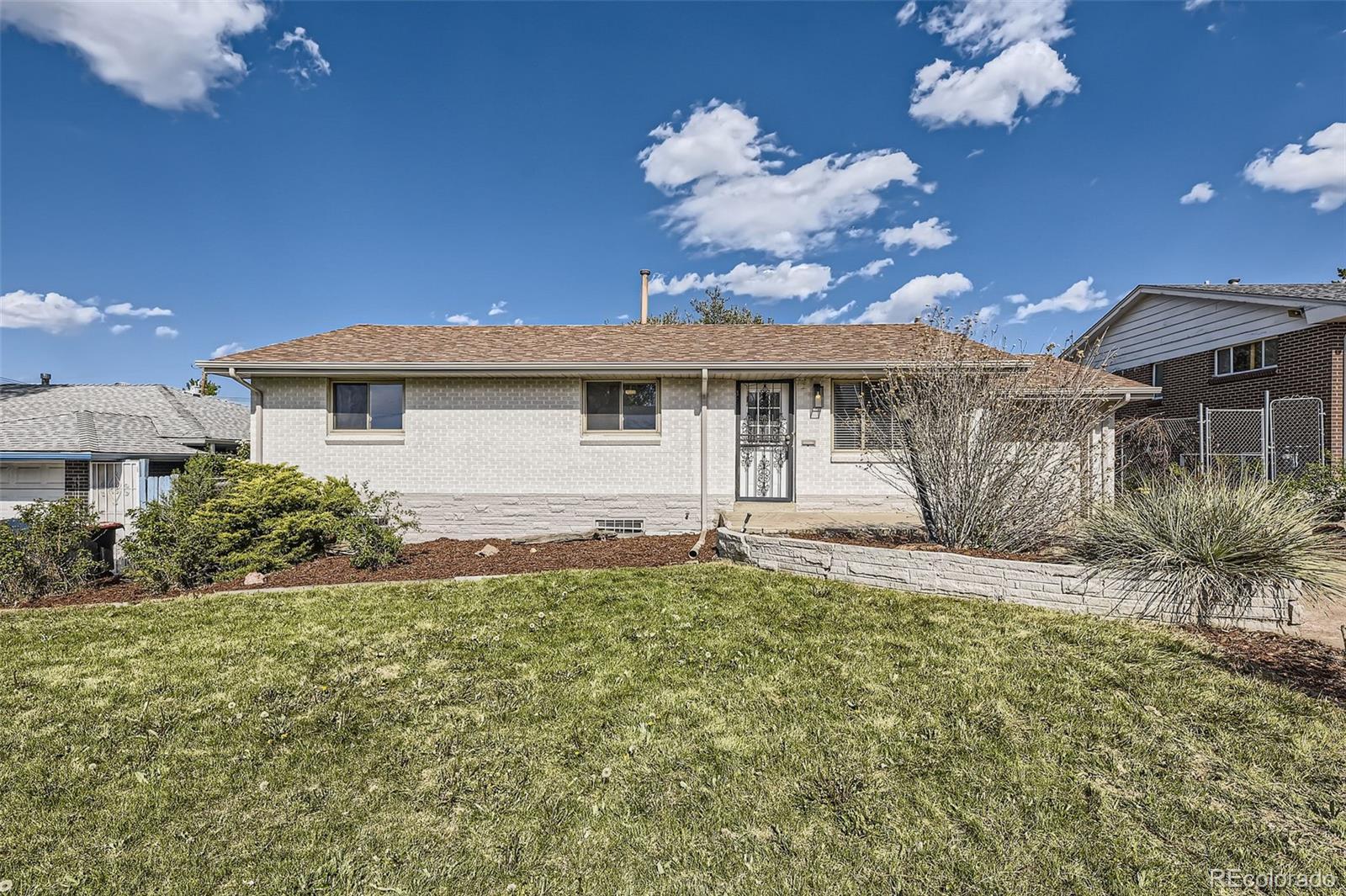 Property Photo:  1926 S Yates Street  CO 80219 