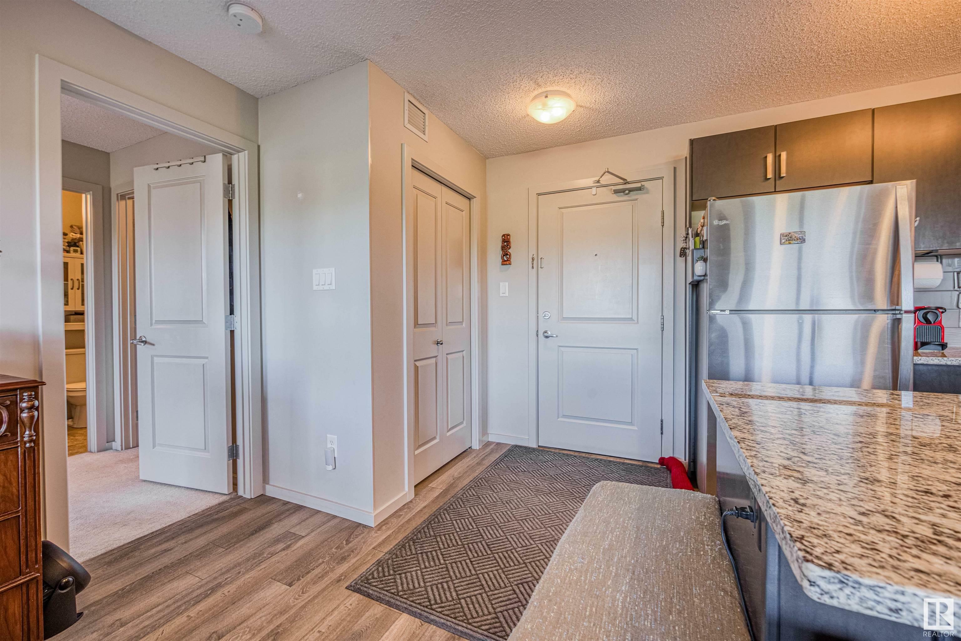 Property Photo: 142 Ebbers Boulevard NW 211 AB T5Y 3W2