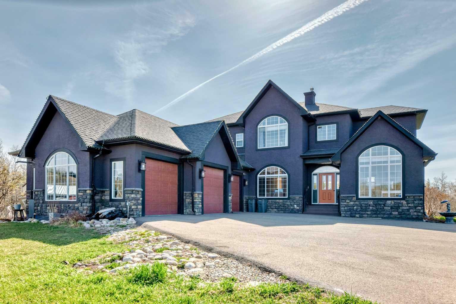 Property Photo: 298034 218 Street W AB T1S 2Y6