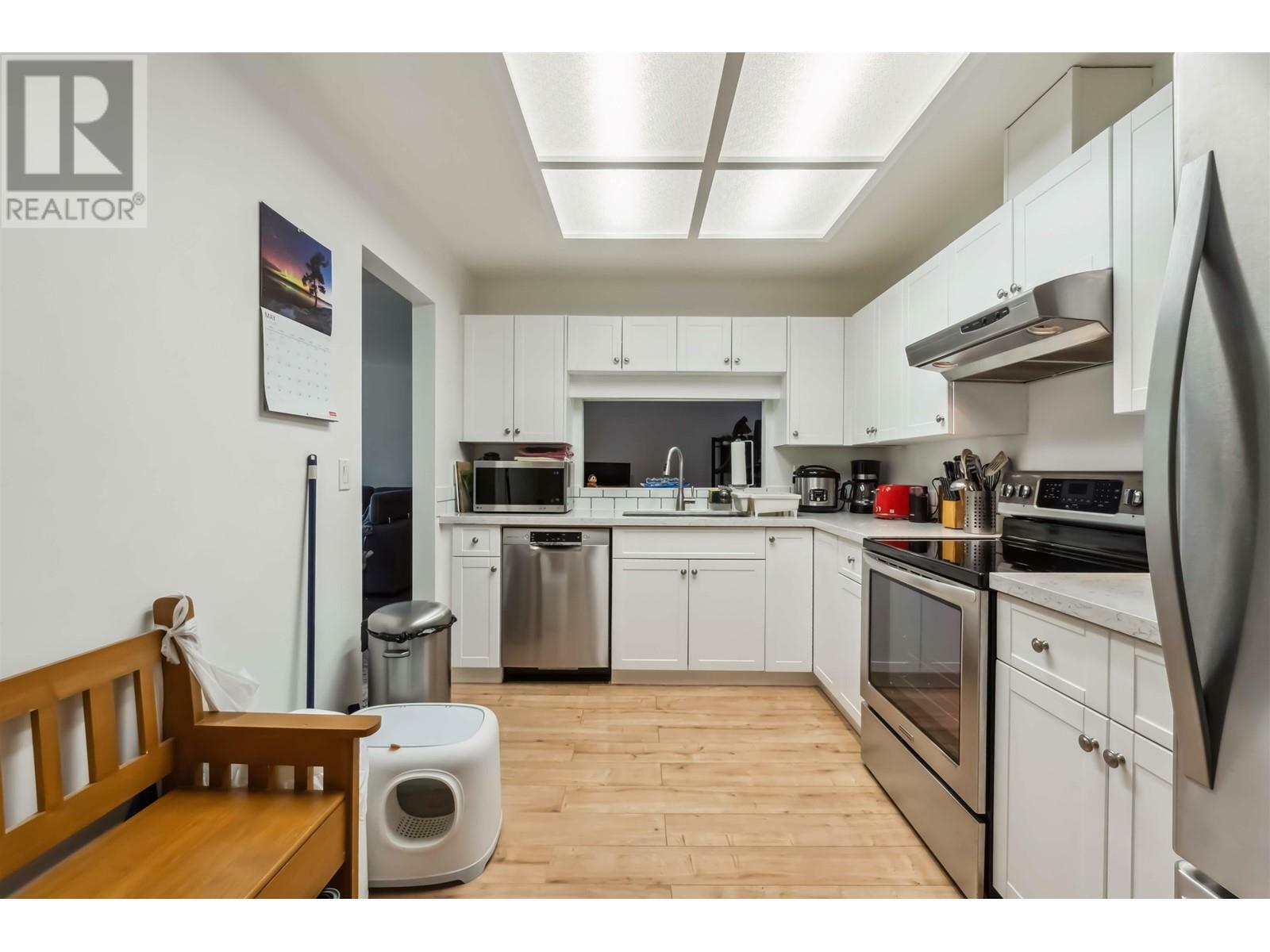 Property Photo: 19241 Ford Road 311 BC V3Y 2N4