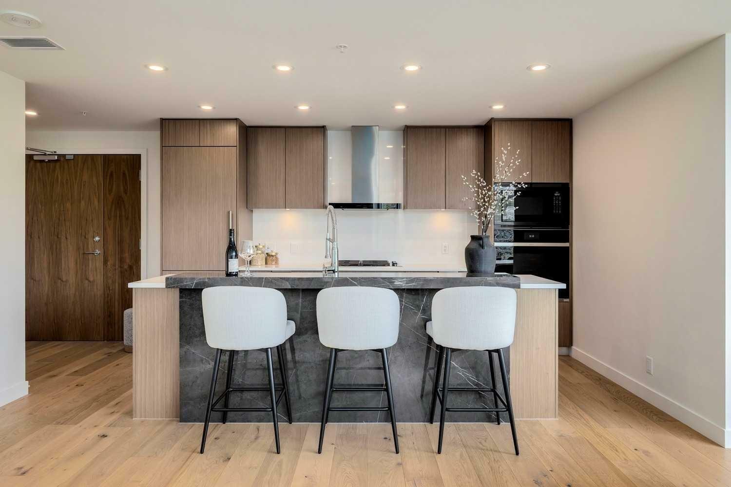 Property Photo: 128 Waterfront Court SW 202 AB T2P 1K9