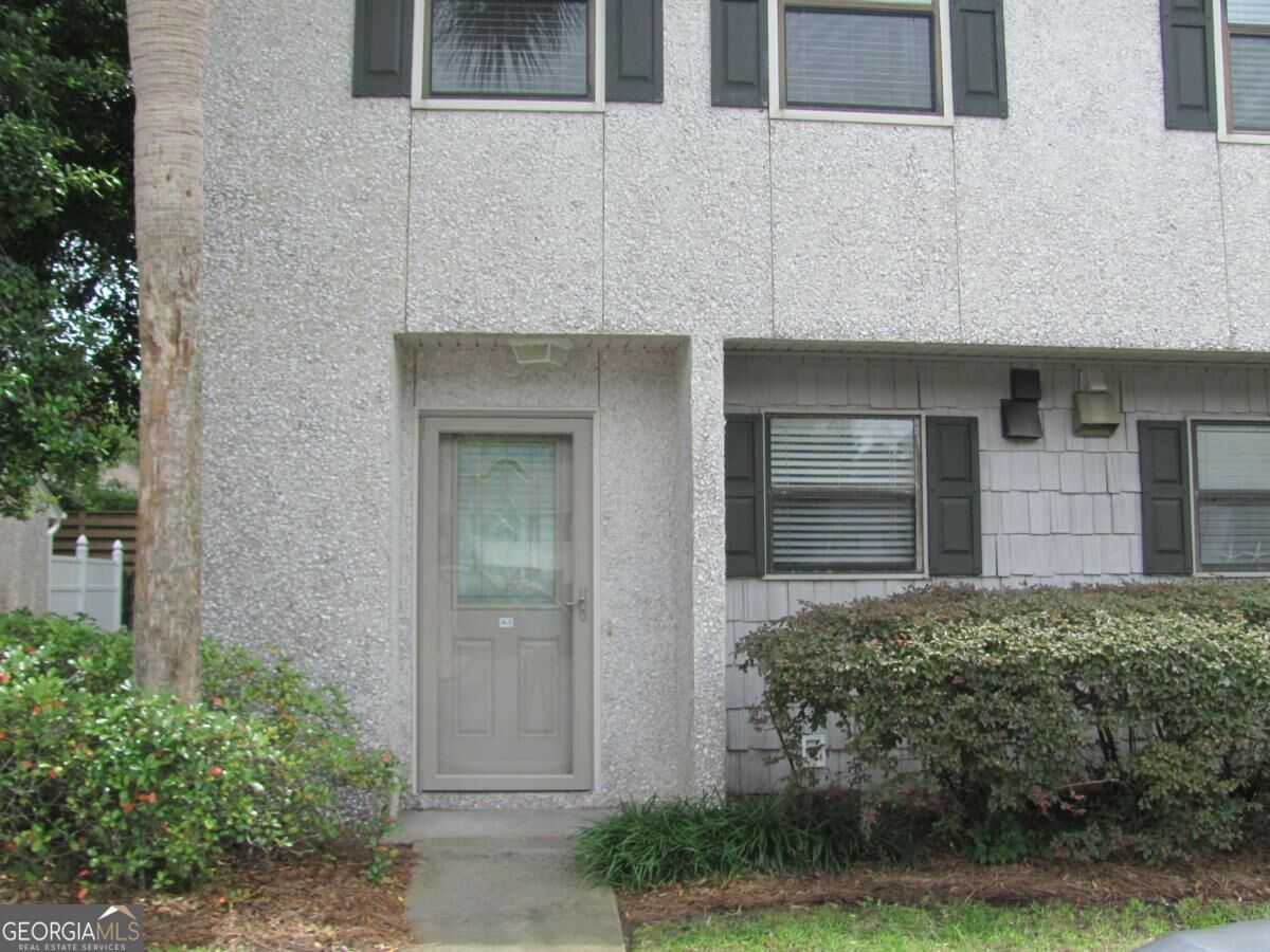 Property Photo:  104 Courtyard Villas Lane #A1  GA 31522 