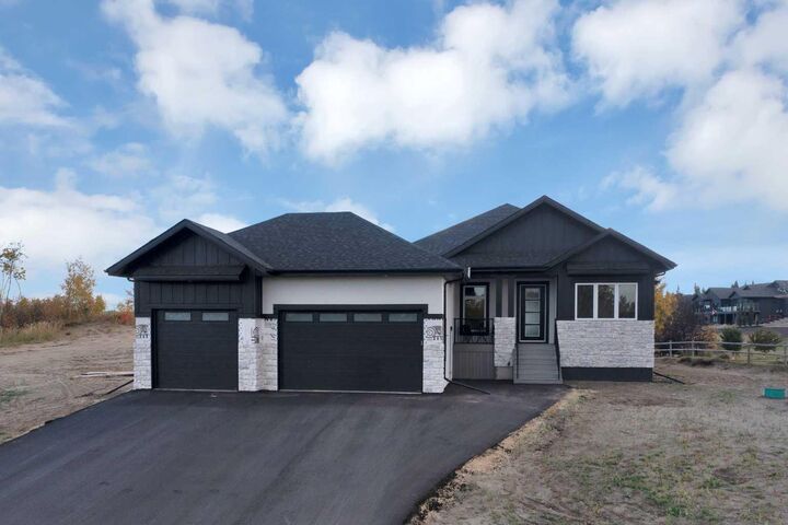 Property Photo: 305 Wolf Run Drive AB T4L 1X9