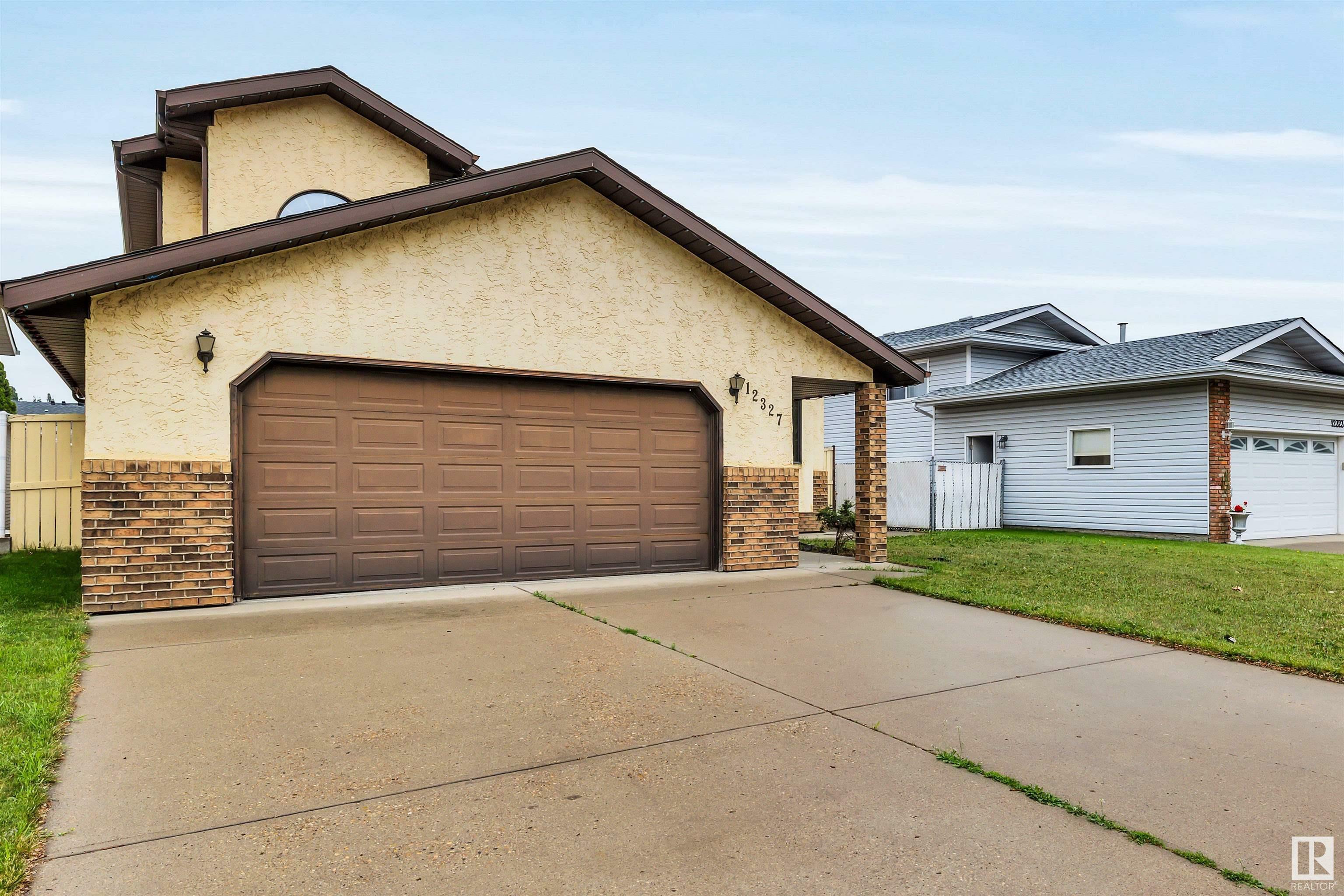 Property Photo: 12327 57 Street NW AB T5W 5E8