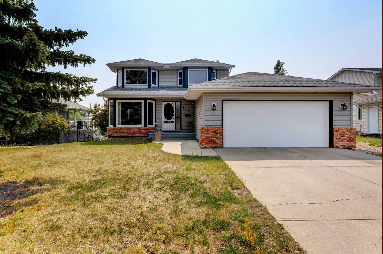 Property Photo:  711 High Country Drive NW  AB T1V 1E3 