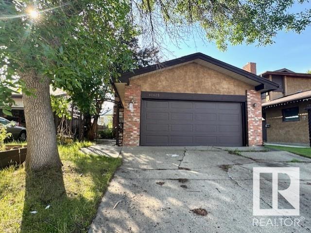 Property Photo: 12125 25 Avenue NW AB T6J 4S7
