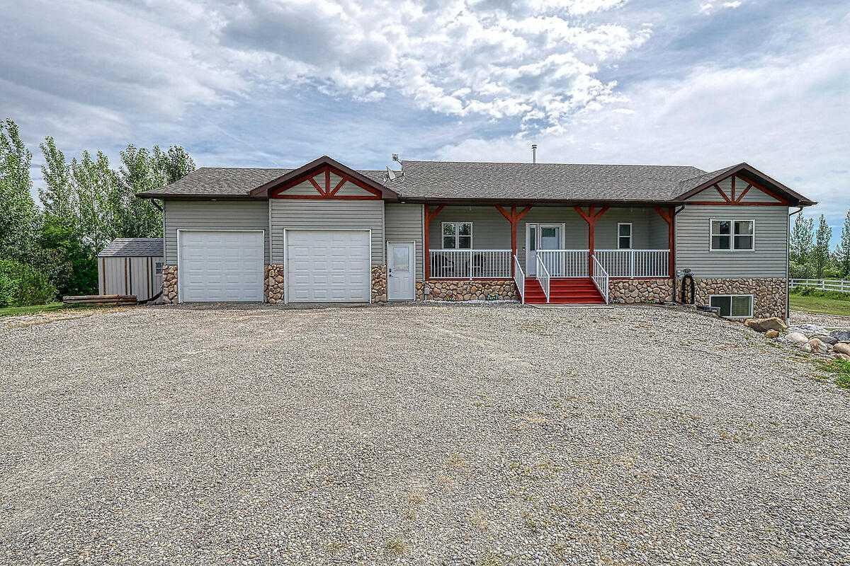 Property Photo: 290048 34 Street W AB T1S 7A5