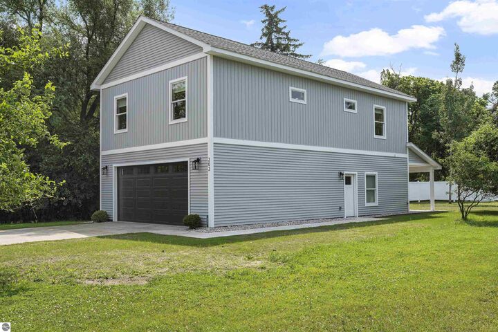 Property Photo:  202 W Carpenter Street  MI 49720 