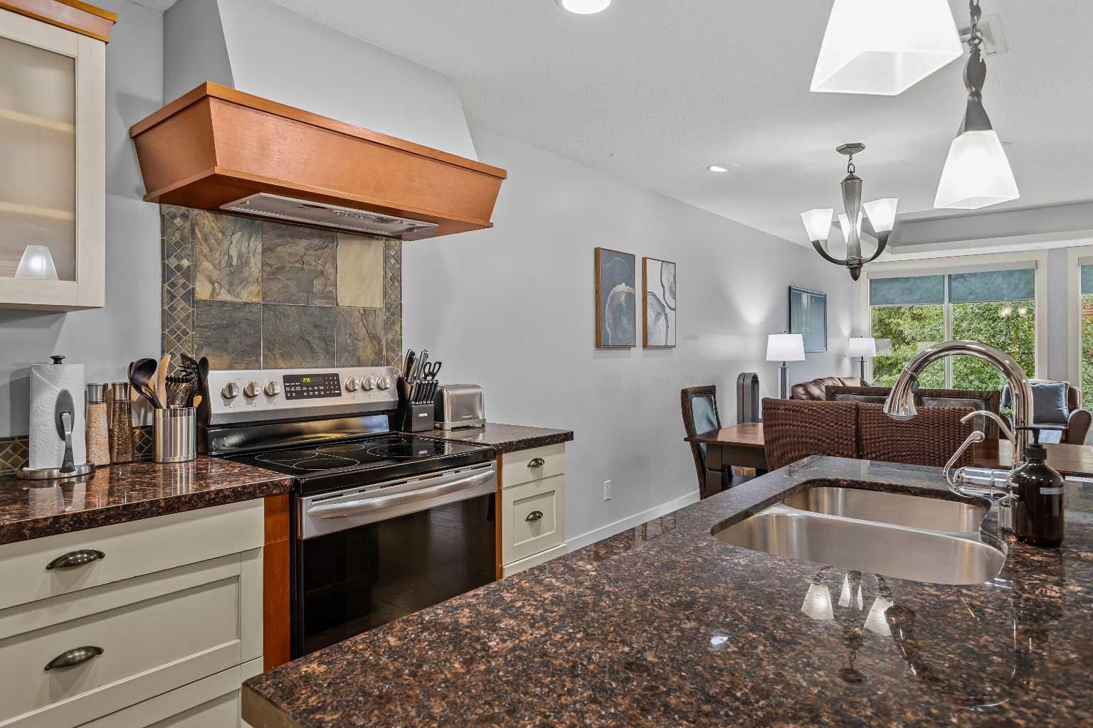 Property Photo:  187 Kananaskis Way 213  AB T1W 0A3 