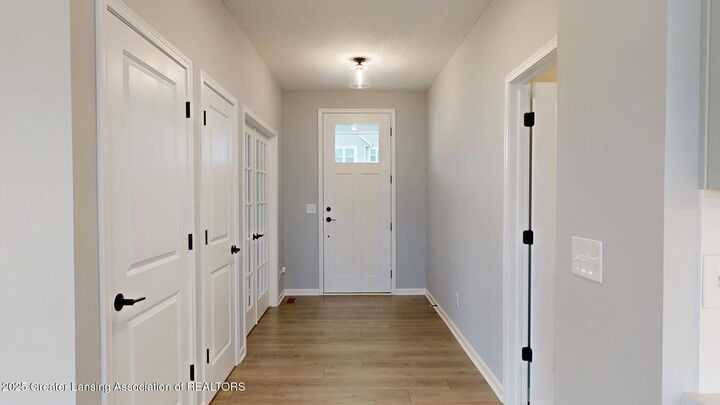 Property Photo:  621 Titanium Trail  MI 48840 