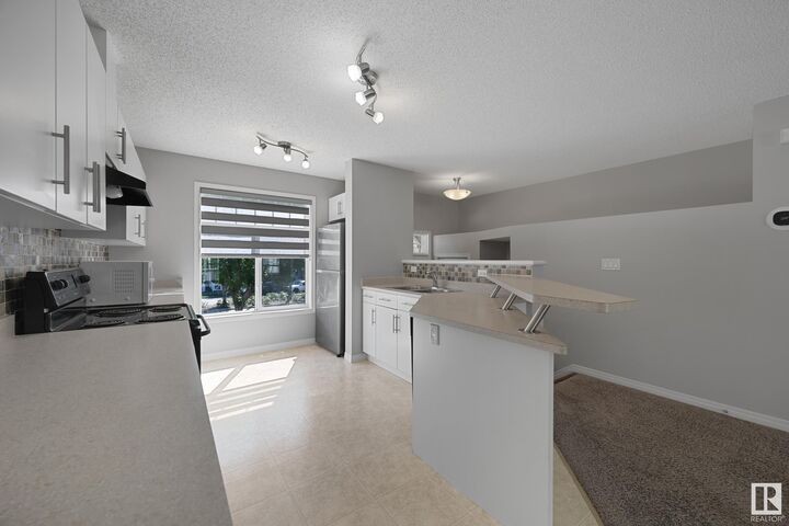 Property Photo: 465 Hemingway Road NW 133 AB T6M 0J7