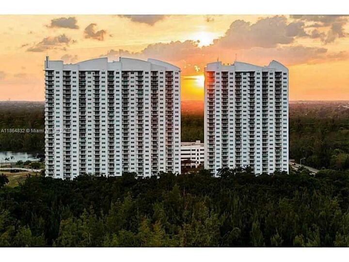 Property Photo: 14951 Royal Oaks Ln 1909 FL 33181