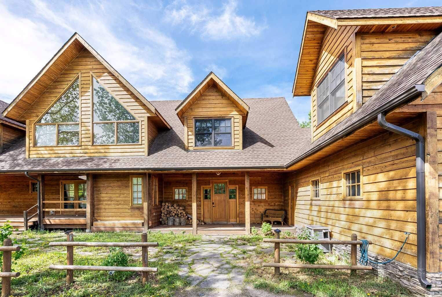 Property Photo: 32075 402 Avenue W 200 AB T1S 6A6