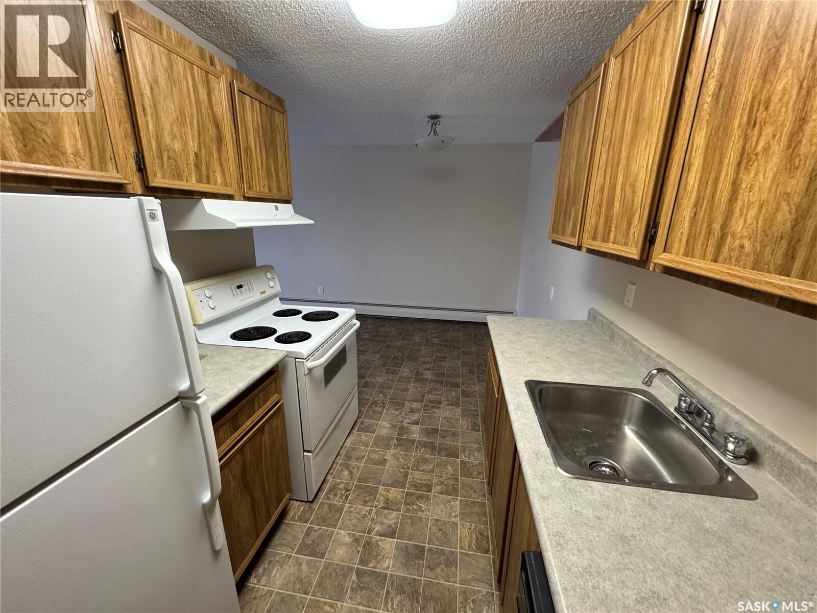 Property Photo:  306 1808 Eaglesham Avenue  SK S4H 3A8 