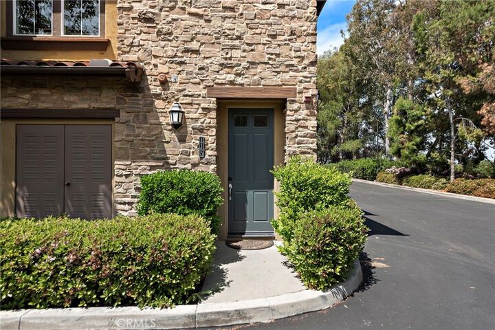 Property Photo:  115 Coral Rose  CA 92603