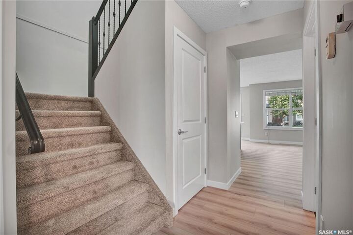 Property Photo: 410 Ledingham Way 213 SK S7V 0C4